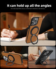 Load image into Gallery viewer, 360 Rotation MagSafe Holder iPhone Case on a desk, doubling as a stand.